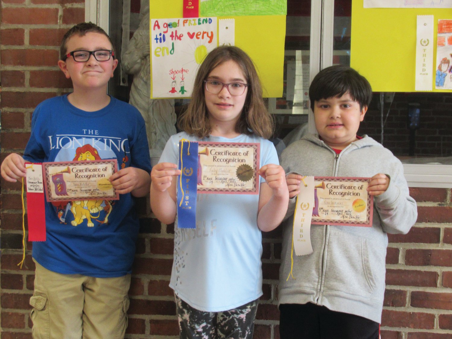 KIND KIDS: Winsor Hill students Owen Botelho (left), took second place in the school’s Friendship Poster Contest while Finley Shavlier was first and Noah Guimmaraes placed third.